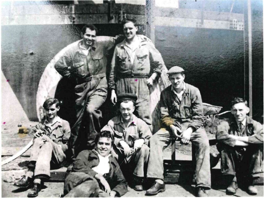 Mudhafer Al-Khalidi, top left, with his arm around the shoulder of a friend
